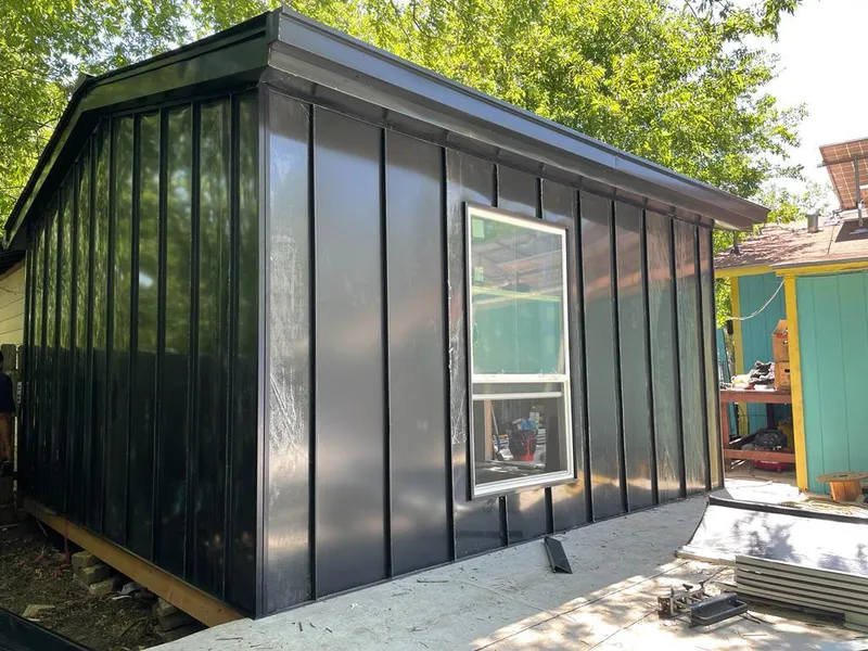 Black standing seam metal wall panels for Roof Inspection in Yeadon